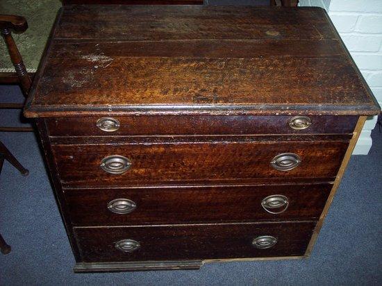 Appraisal: A th Century chest of four long graduated drawers cm