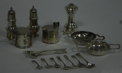 Appraisal: A pair of silver pepper pots London of baluster form