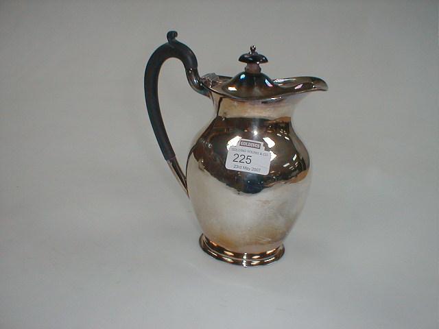 Appraisal: A George V silver hot water jug Maker HA Sheffield