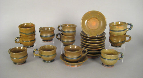 Appraisal: Ten brown glazed redware cups and saucers by Stahl dated