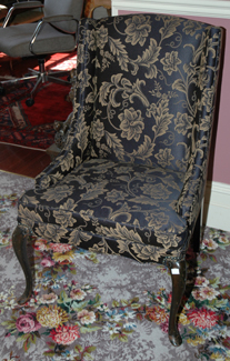 Appraisal: A PAIR OF REGENCY STYLE FLORAL UPHOLSTERED WING BACK CHAIRS