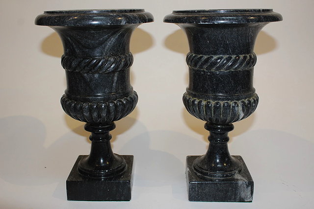 Appraisal: A PAIR OF GREY MARBLE URNS AFTER ANTIQUE of classical