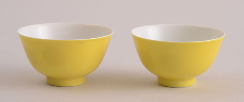 Appraisal: PAIR OF CHINESE YELLOW-GROUND PORCELAIN CUPS With underglaze blue six-character