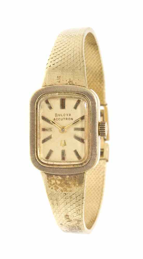 Appraisal: A Karat Yellow Gold Wristwatch Bulova Accutron matte gilt dial