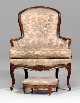 Appraisal: Provincial Louis XV bergere fruitwood with flower-carved skirt and cabriole