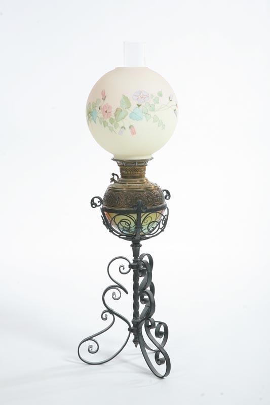 Appraisal: PIANO LAMP Scrolling wrought iron base with a brass font