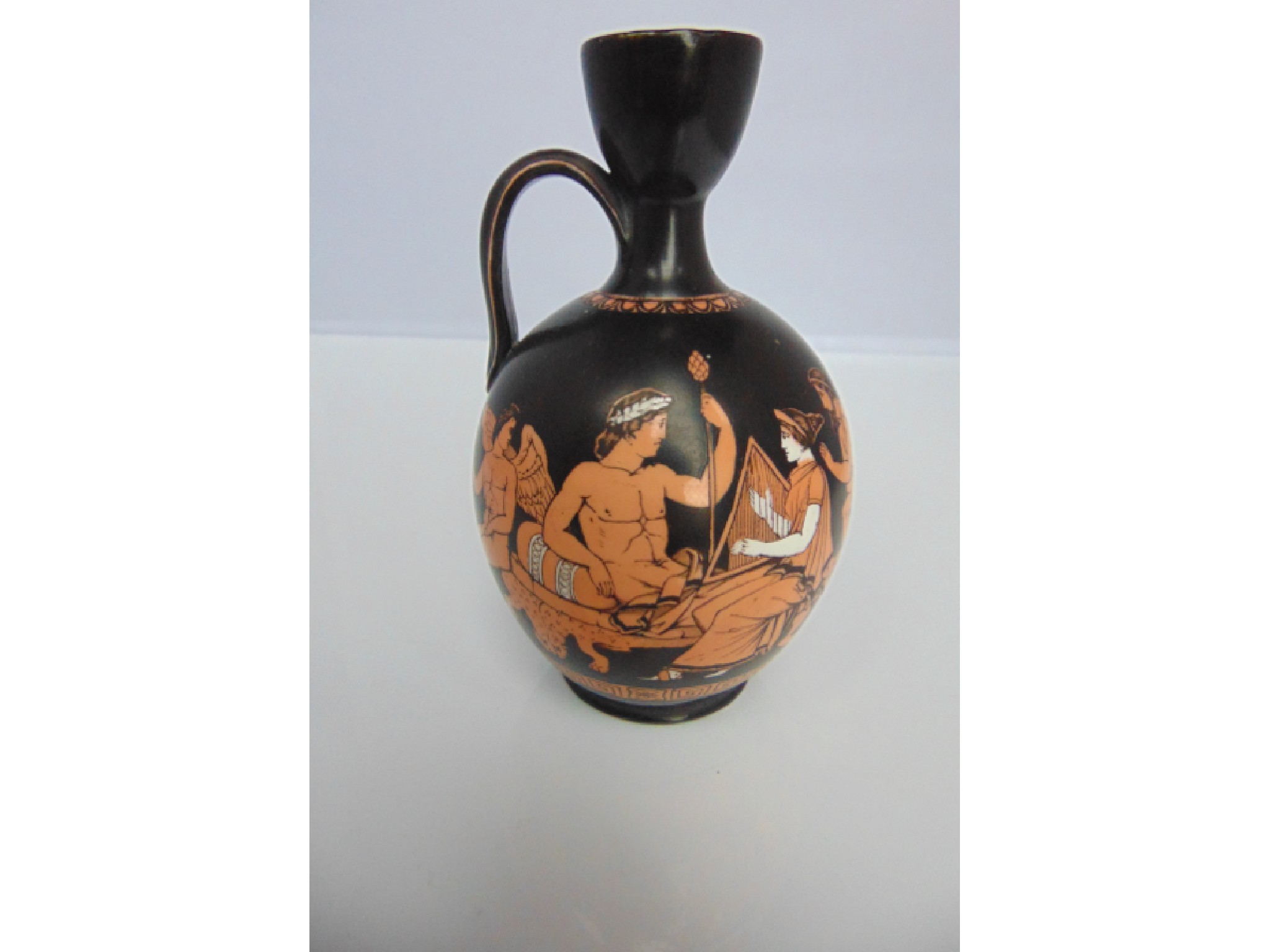 Appraisal: A th century black ground Jackfield Samuel Alcock type ewer