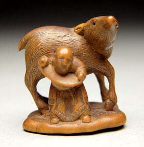 Appraisal: ANTIQUE WOOD NETSUKE Well carved and antique wood netsuke of