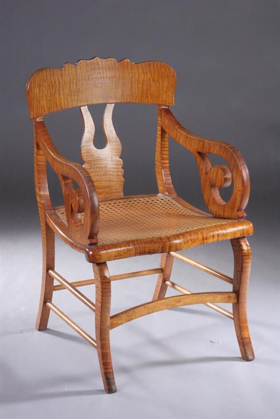 Appraisal: AMERICAN EMPIRE TIGER MAPLE OPEN ARMCHAIR circa Tablet-form crest above