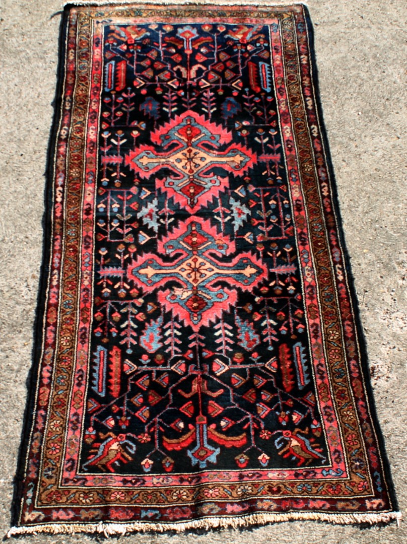 Appraisal: An Iranian Azary rug in red and blue in geometric