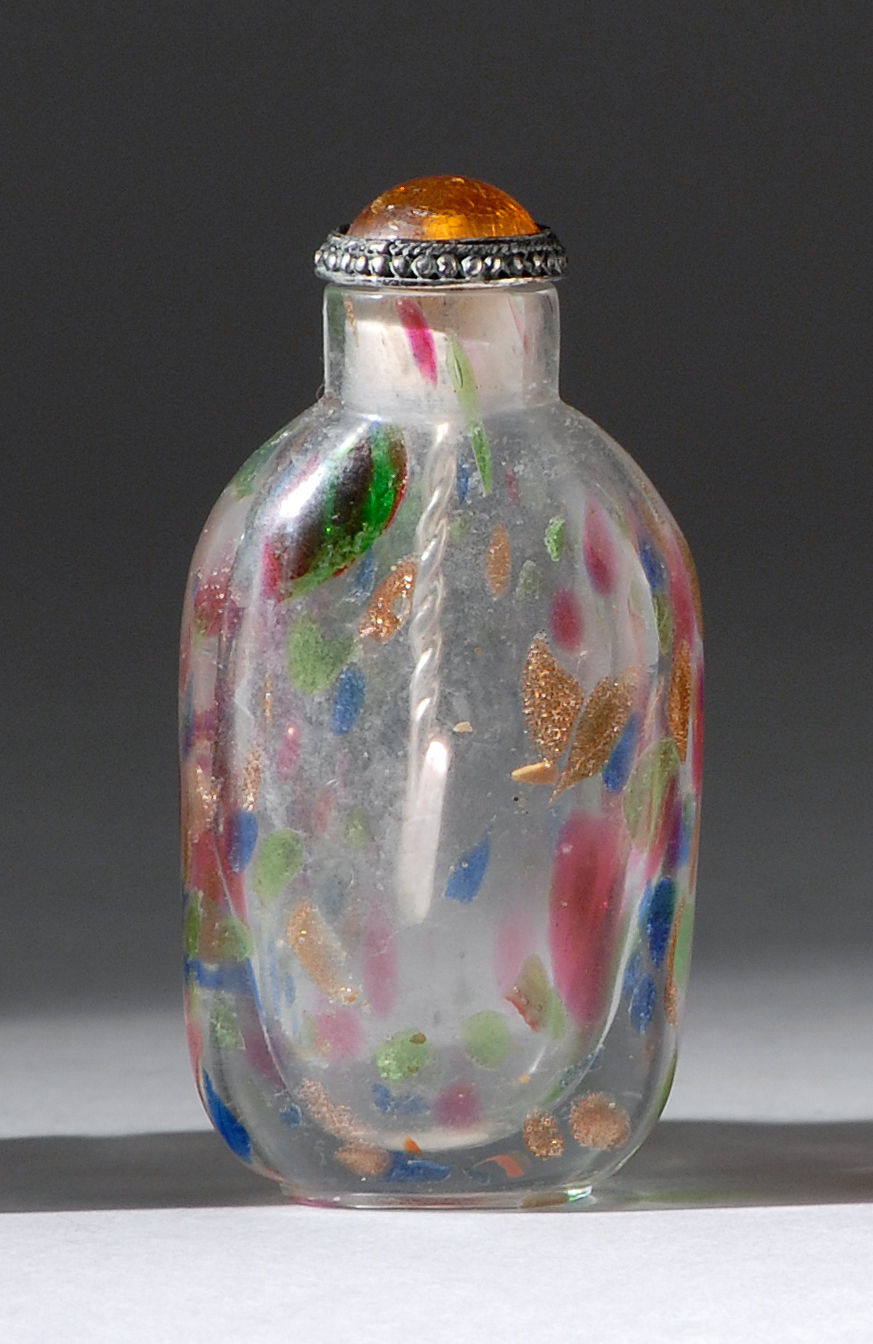 Appraisal: SPANGLE GLASS SNUFF BOTTLE Early th CenturyIn elongated ovoid form