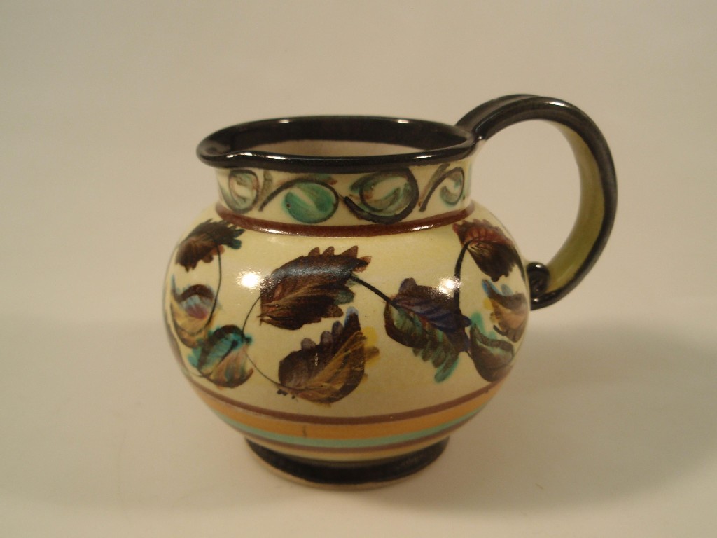 Appraisal: A Glyn Colledge for Denby jug painted with autumnal leaves