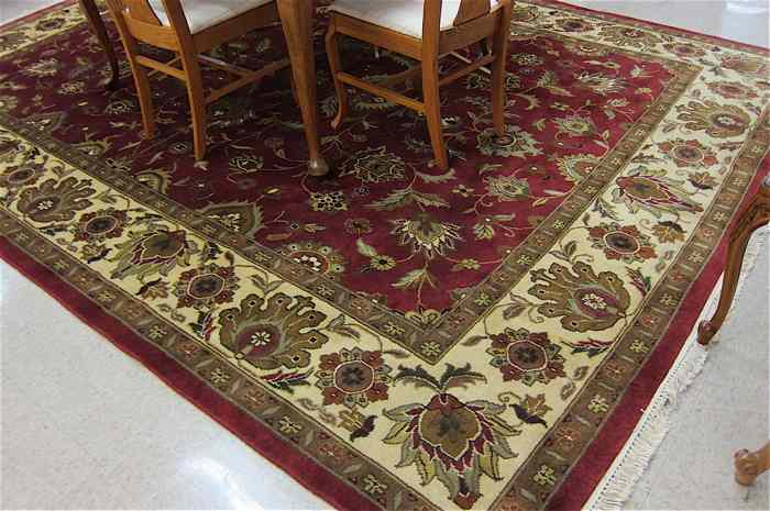 Appraisal: HAND KNOTTED ORIENTAL CARPET Indo-Persian Kashan design featuring an overall