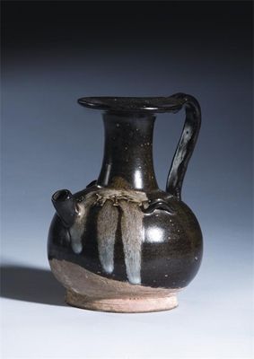 Appraisal: A Chinese phosphatic glazed stoneware ewer decorated with a splashed