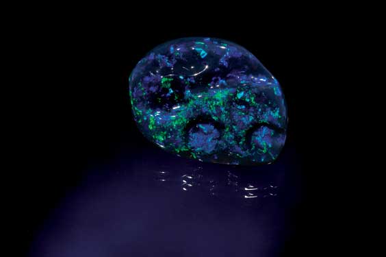 Appraisal: FREE-FORM BLACK OPAL CARVING Lightning Ridge Australia Lightning Ridge is