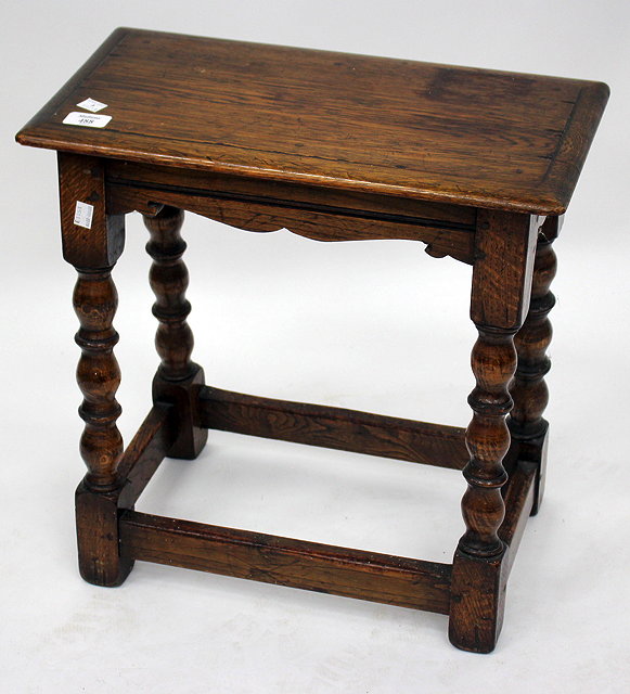 Appraisal: AN OLD OAK JOINT STOOL on turned tapering legs united