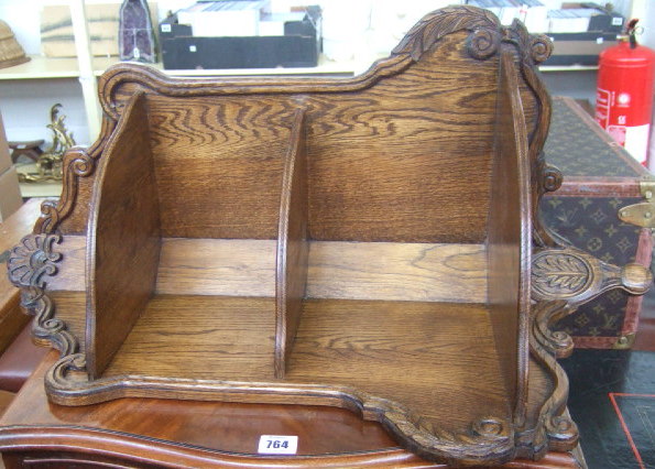 Appraisal: A th century stained oak hanging corner shelf with shell