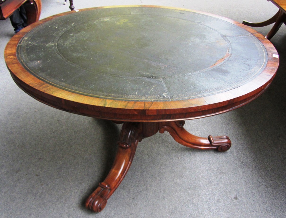 Appraisal: A Victorian rosewood and mahogany circular centre table with leather