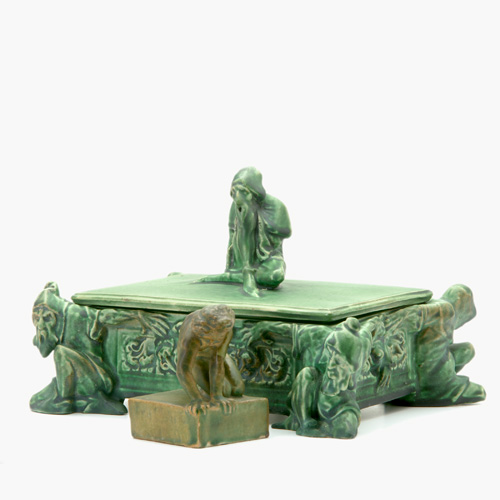 Appraisal: ATLANTIC Two figural pieces covered in green vellum glaze a