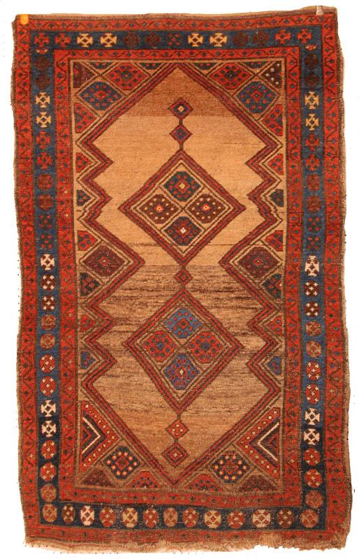 Appraisal: A ORIENTAL RUG Tribal late th-early th century Geometric red