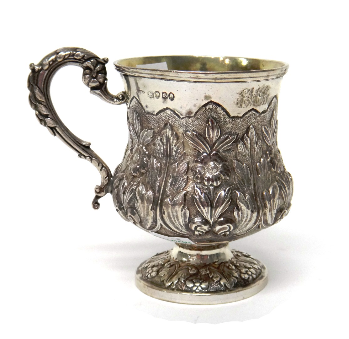 Appraisal: A silver christening mug embossed with flowers and foliage with