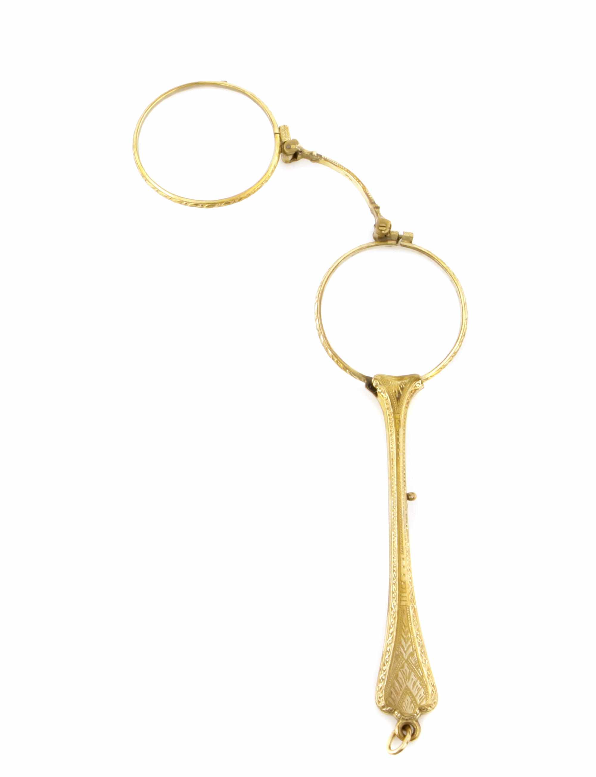 Appraisal: A gold lorgnette opening to reveal bifocals