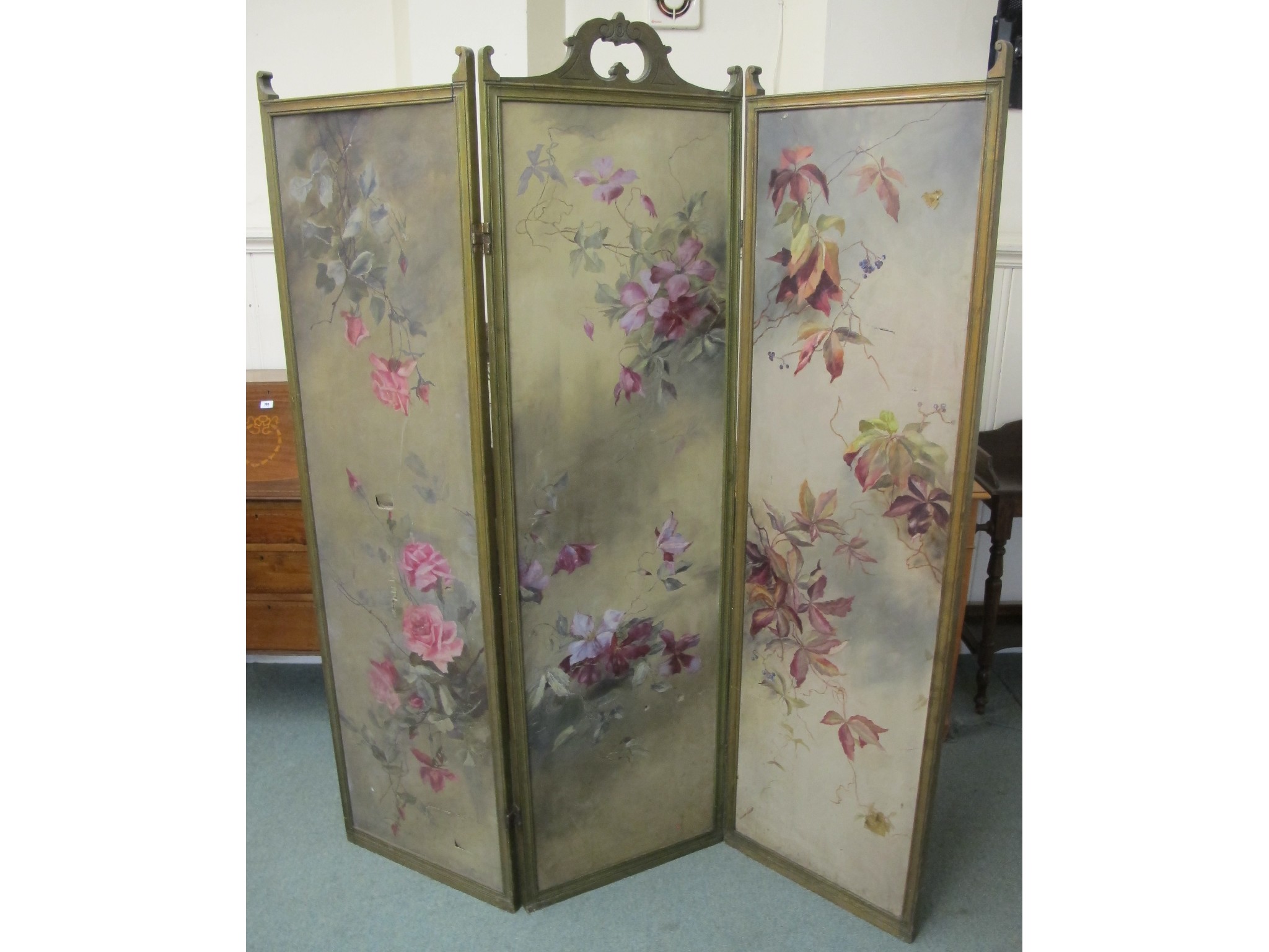 Appraisal: An Edwardian oak framed draught screen painted with flowers