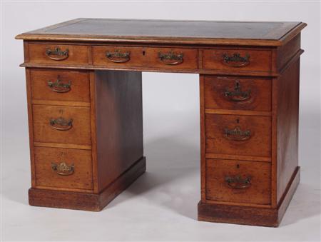 Appraisal: An early th century small oak twin pedestal desk the