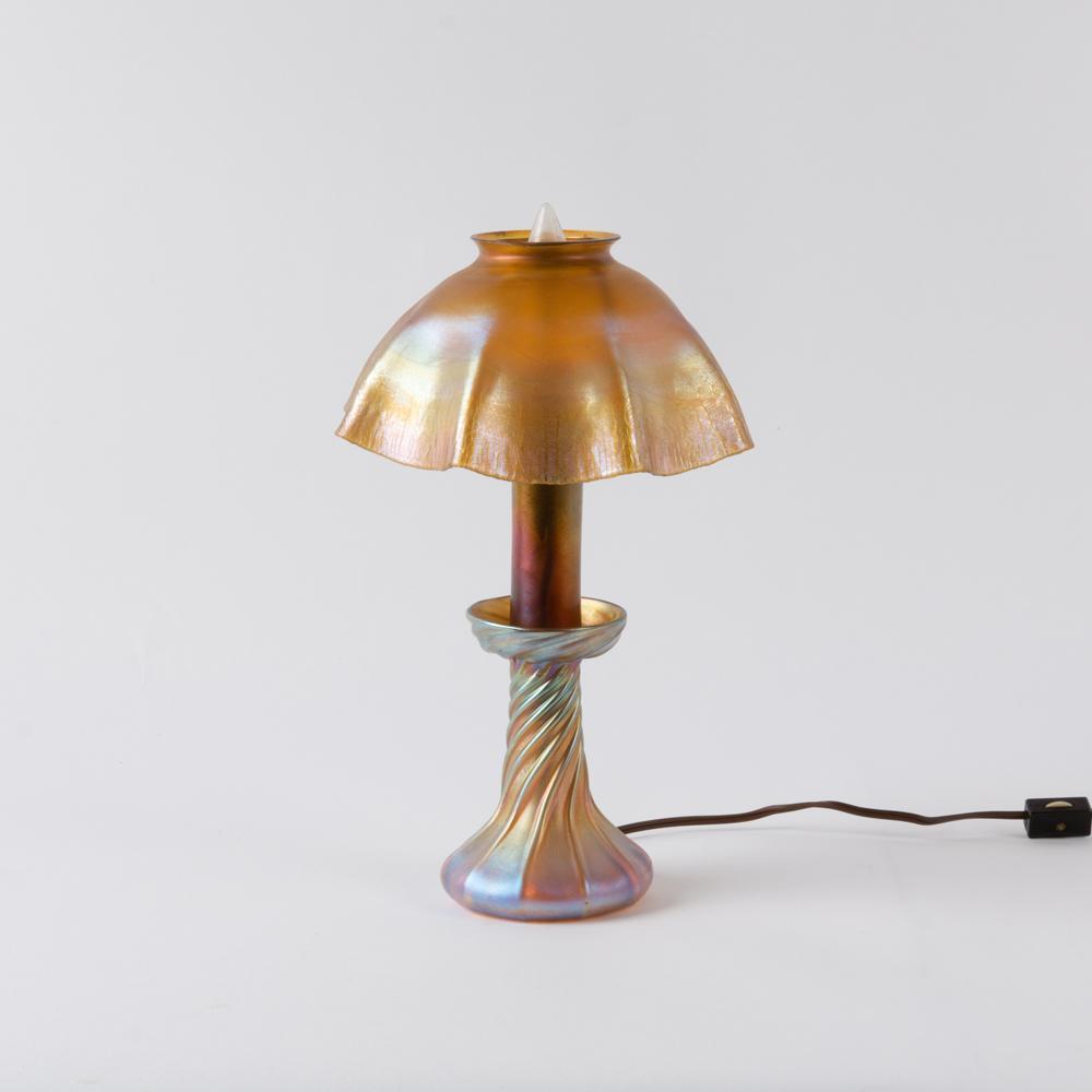 Appraisal: TIFFANY STUDIOS FAVRILE CANDLESTICK LAMP An iridescent Favrile glass Tiffany