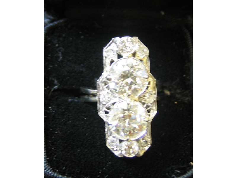 Appraisal: DIAMOND RING Set with two European cut diamonds One ct