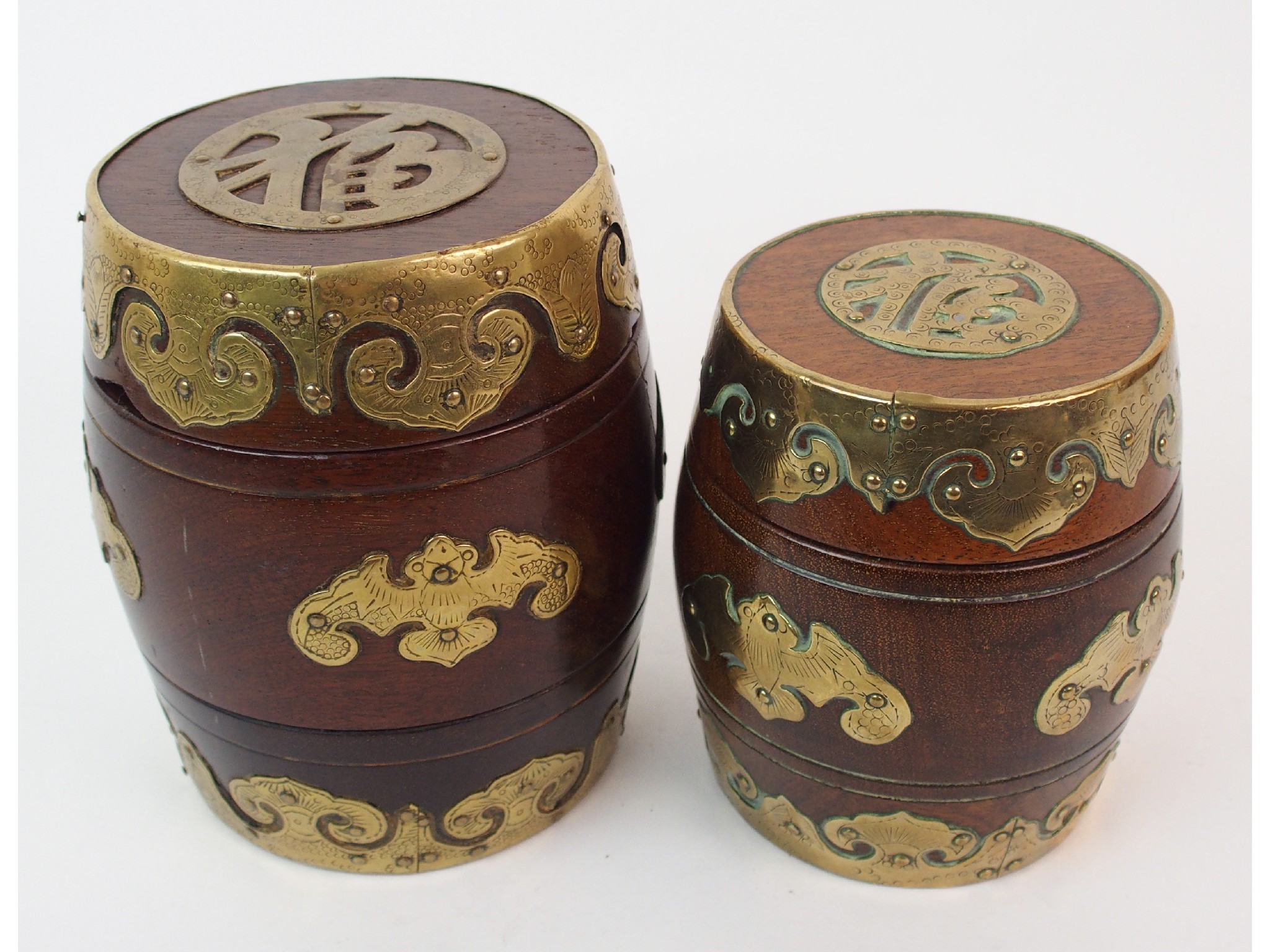 Appraisal: Two Chinese hardwood and brass mounted barrel shaped tobacco jarsdecorated