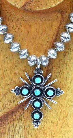 Appraisal: Native American silver content unknown necklace cross-form pendant signed T