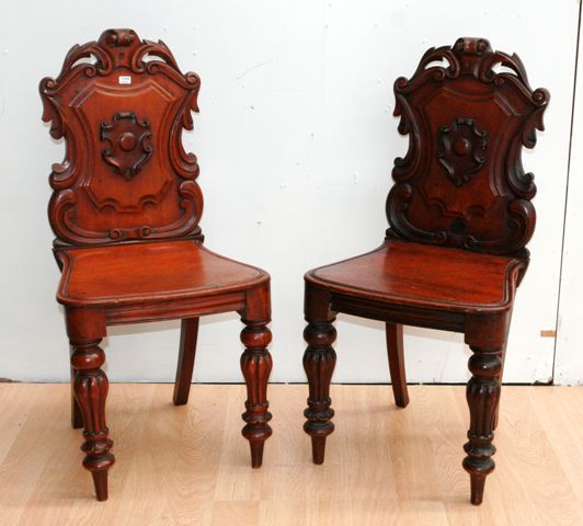 Appraisal: A pair of Victorian shield back hall chairs