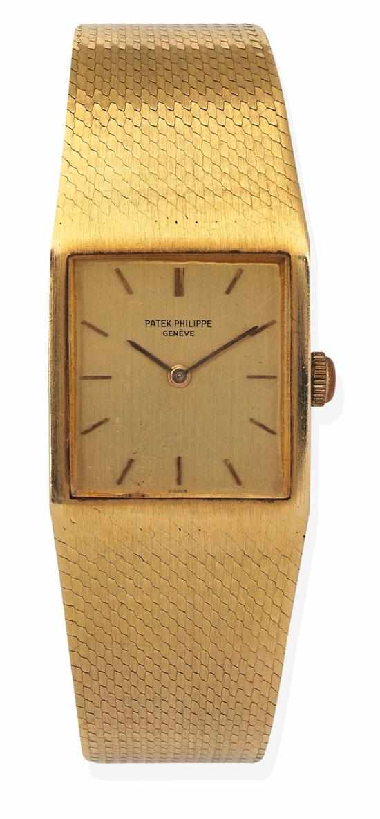 Appraisal: A PATEK PHILIPPE GOLD WRISTWATCH Manual wind movement rectangular golden