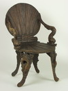 Appraisal: GROTTO CHAIR - th C carved wood shell form Italian