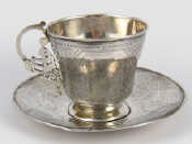 Appraisal: A Russian silver cup and saucer P A unascribed Moscow