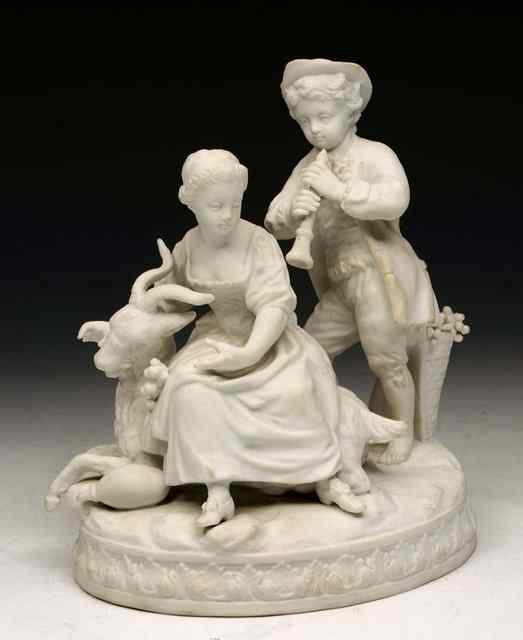 Appraisal: A PARIANWARE FIGURE GROUP modelled as a boy piper serenading