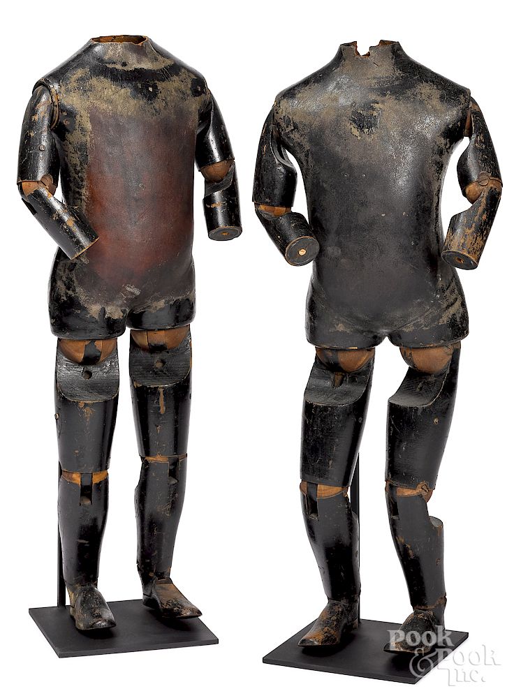 Appraisal: Pair of wood and leather articulated mannequins Pair of wood