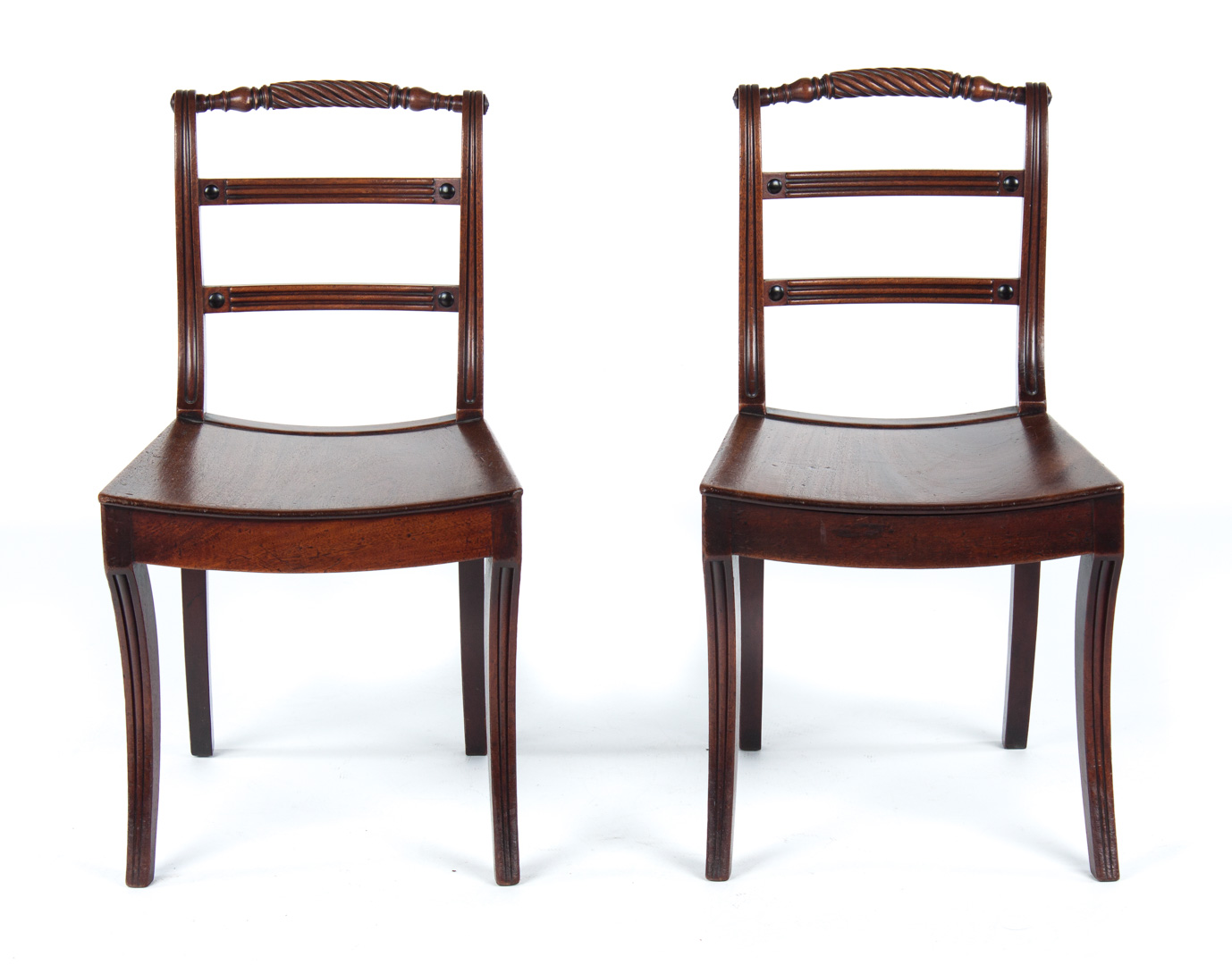 Appraisal: Pair of Regency carved mahogany side chairs circa turned rolling