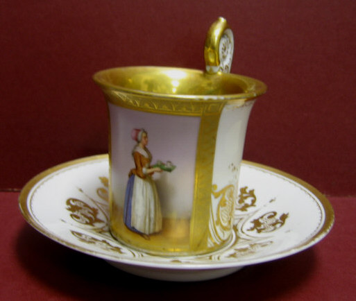 Appraisal: ANTIQUE GERMAN PORCELAIN CUP AND SAUCER Fragonard shaped cup with