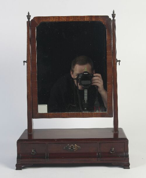 Appraisal: A George III mahogany dressing mirror the rectangular plate between