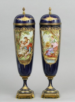 Appraisal: A Pair of Sevres Lidded Urns An impressive pair of