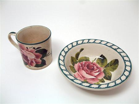 Appraisal: WEMYSS PORRIDGE SAUCER EARLY TH CENTURY decorated with cabbage roses