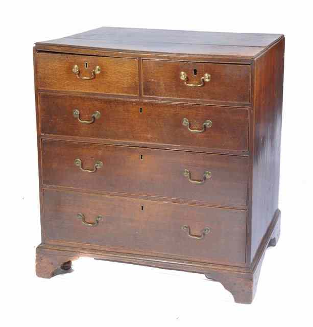 Appraisal: A GEORGIAN OAK CADDY TOP CHEST of two short and