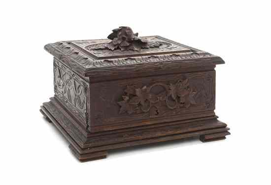 Appraisal: A Black Forest Carved Wood Humidor of square form with