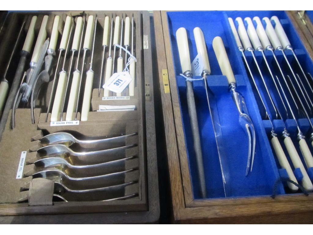 Appraisal: Lot comprising two oak canteens of cutlery