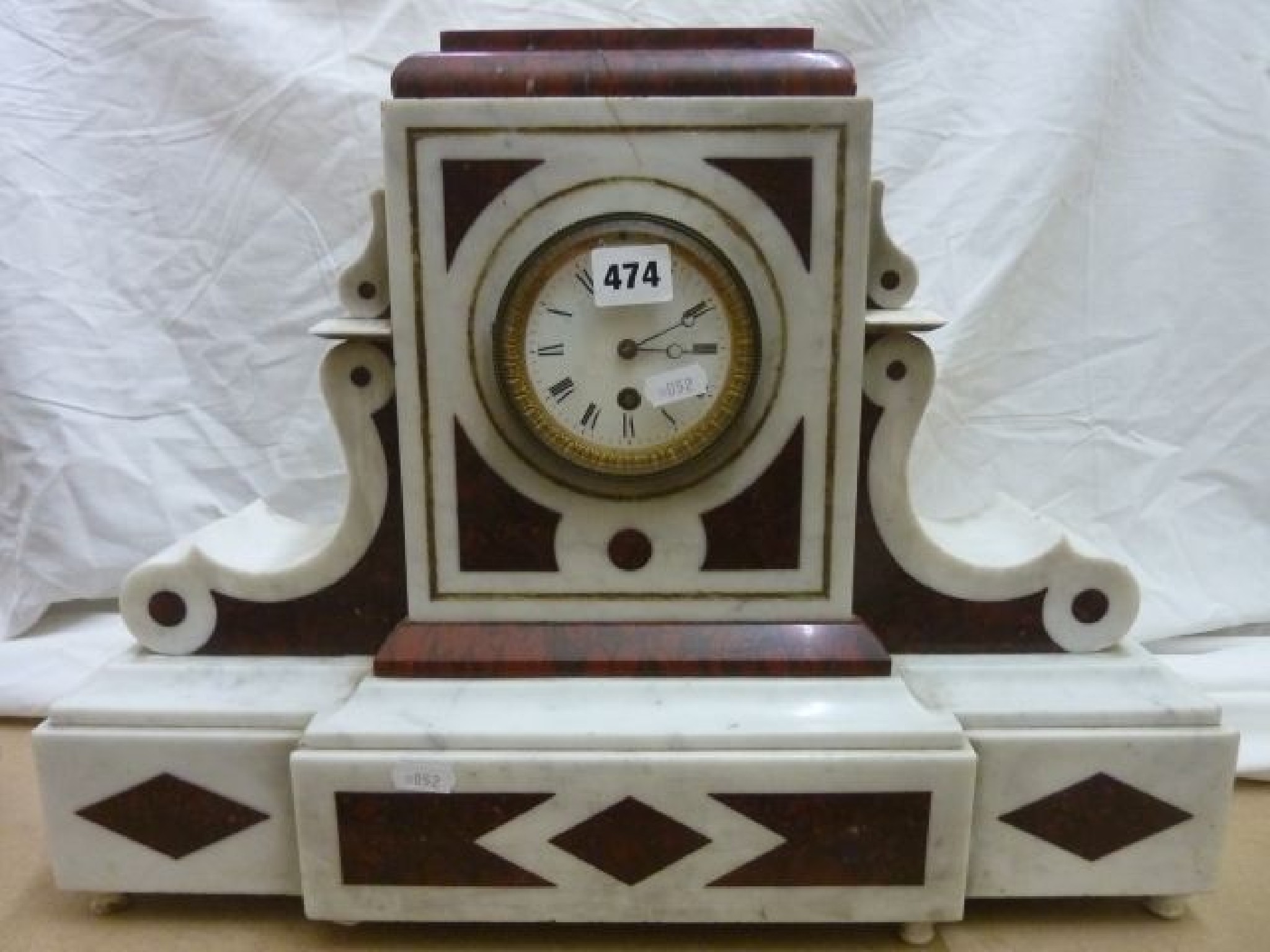 Appraisal: A mid- th century white and red marble mantel clock