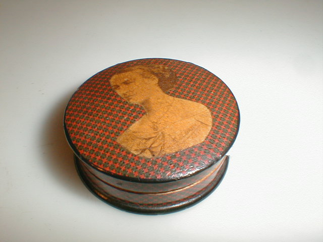 Appraisal: A small wooden Mauchline ware pill box with red and