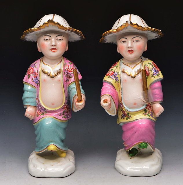 Appraisal: A PAIR OF MEISSEN PORCELAIN FIGURES each modelled as marching