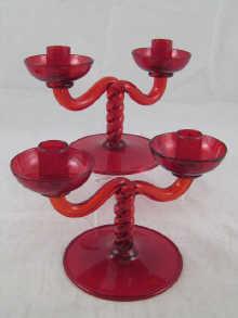 Appraisal: A pair of ruby glass two branch candelabra circa approx